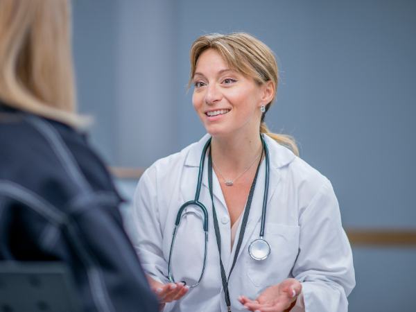 A female mental health professional talks to a patient about addiction detox programs