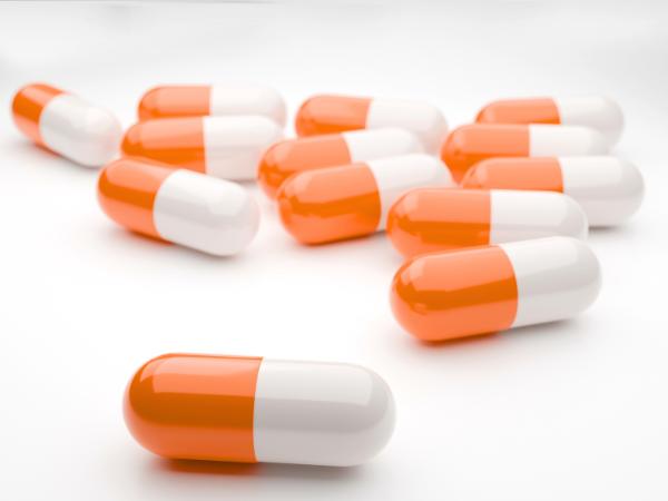 Orange and white prescription drug stimulant capsules
