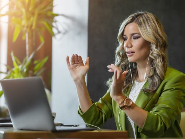 A female executive talking during online mental health therapy