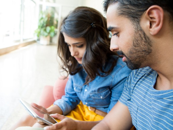 A couple with children taking time for virtual rehab